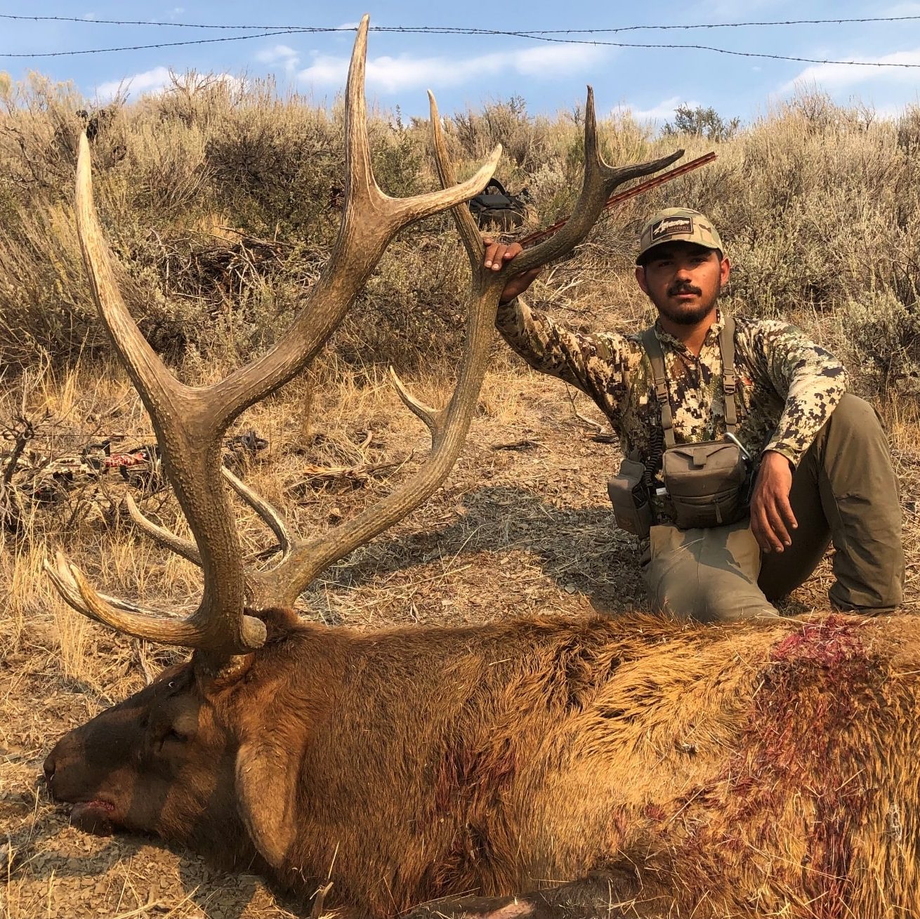 man-posing-with-trophy-six-point-elk